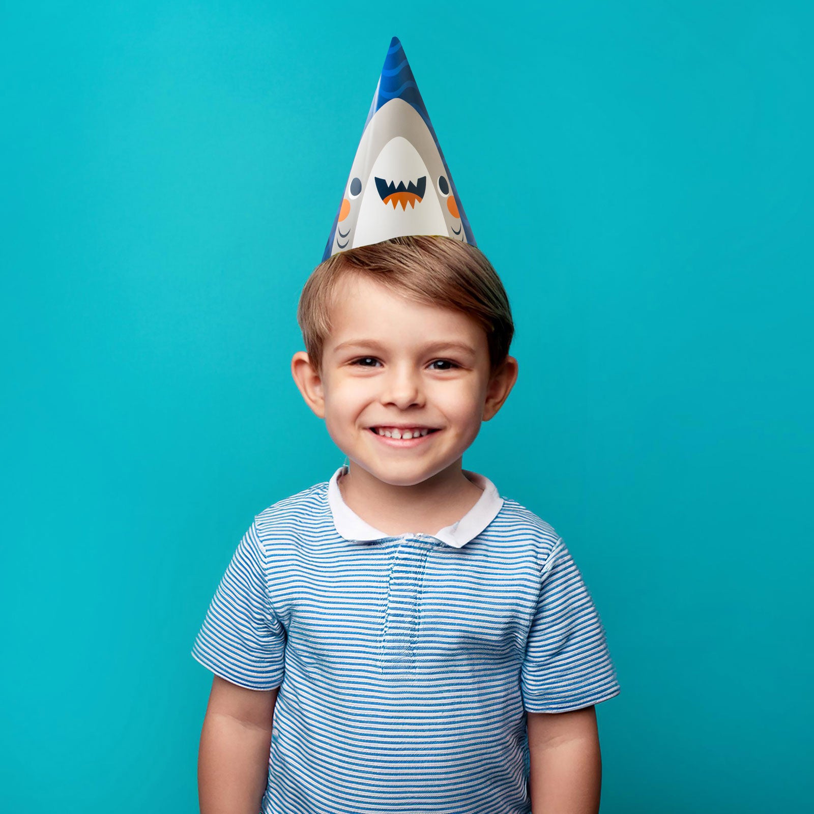 Child wearing paper party hat