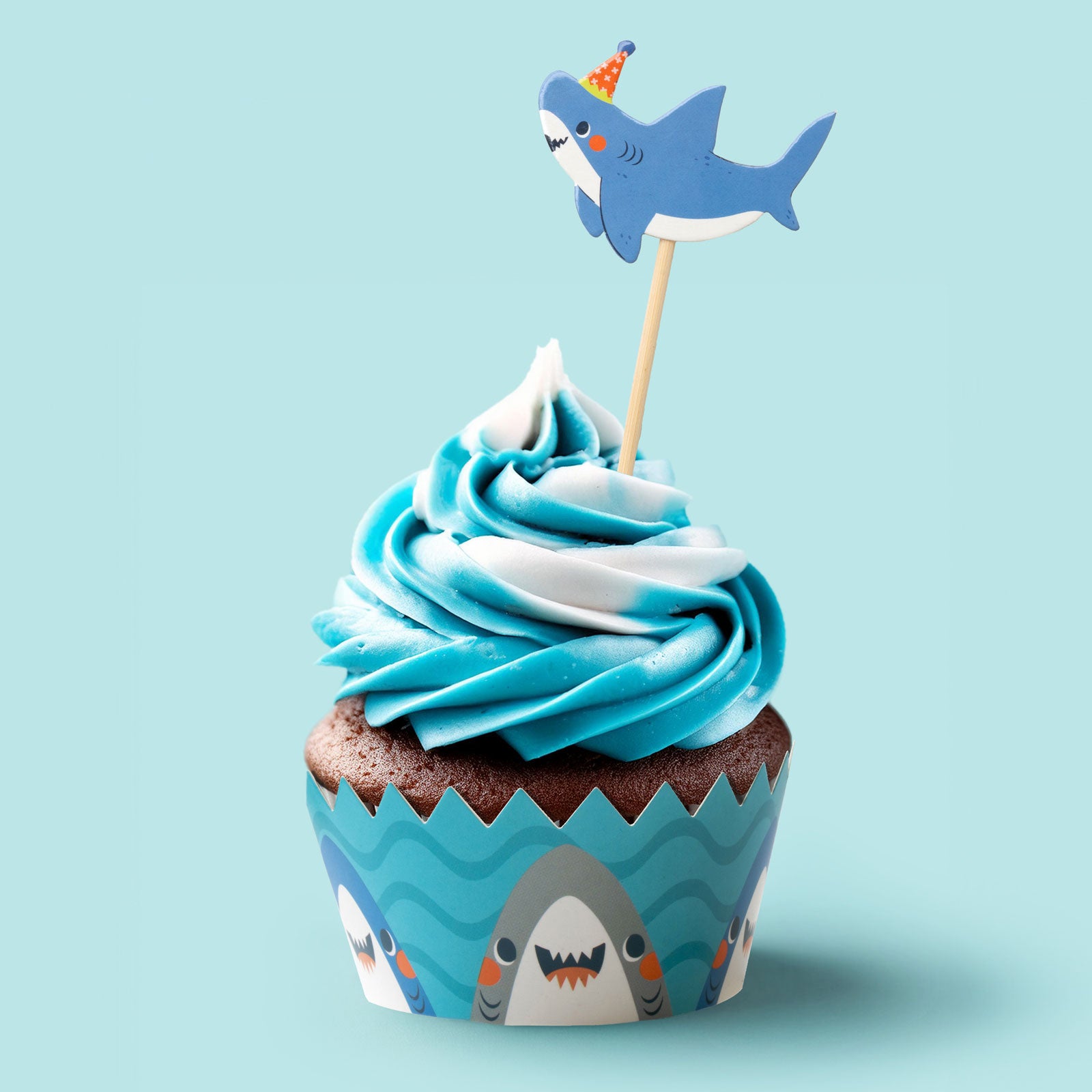 Cupcake with shark cake topper and shark wrapper