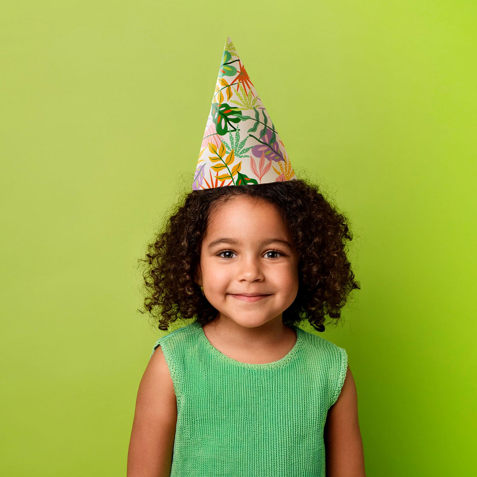 Child wearing paper party hat