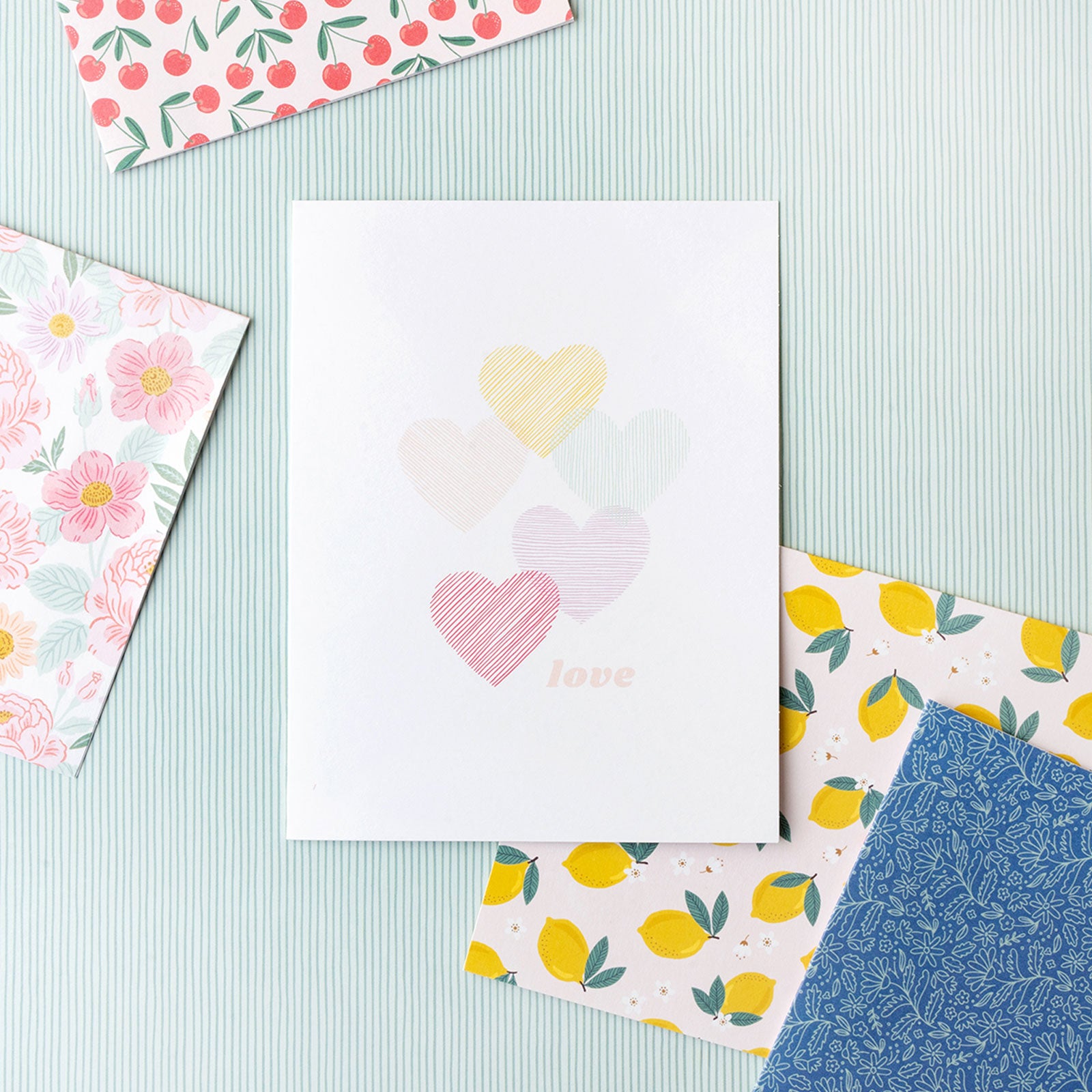 Lifestyle images of the 5 different cards offered with the American Crafts Sketchbook Bea Valint Boxed Cards - 40 Pack