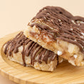 Load image into Gallery viewer, Lifestyle image of drizzled chocolate on AC Sweetshop S'mores Edible Cookie Dough
