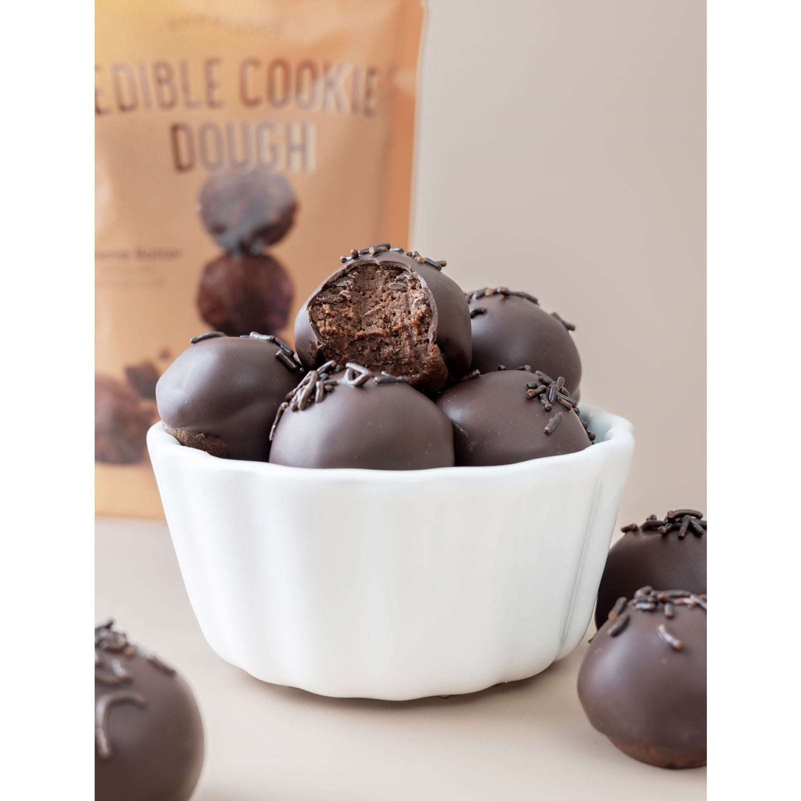 Lifestyle image of chocolate covered AC Sweetshop Brownie Edible Cookie Dough