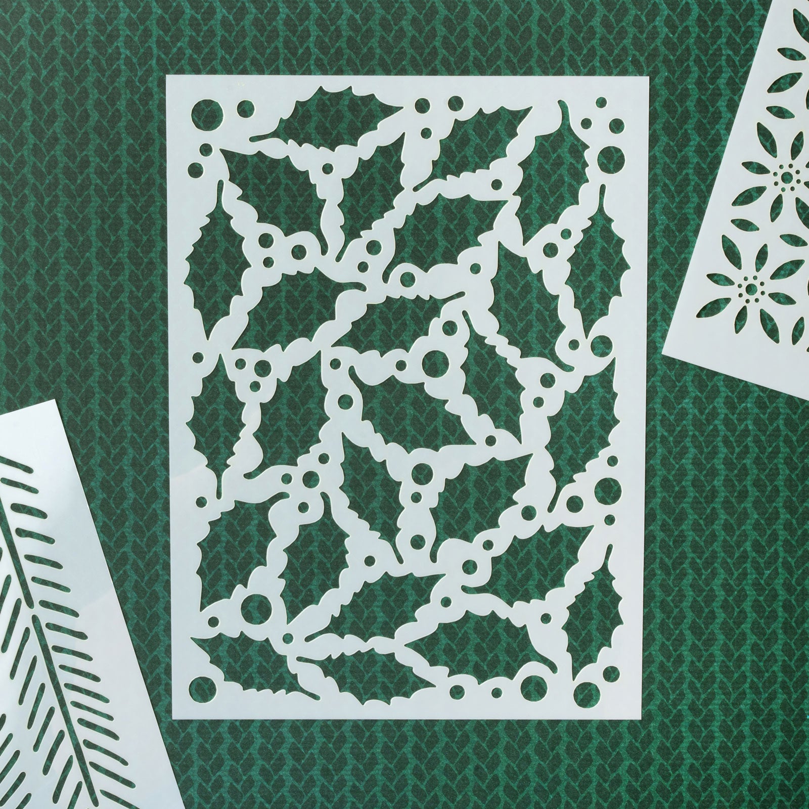 Christmas stencil sheet on green background