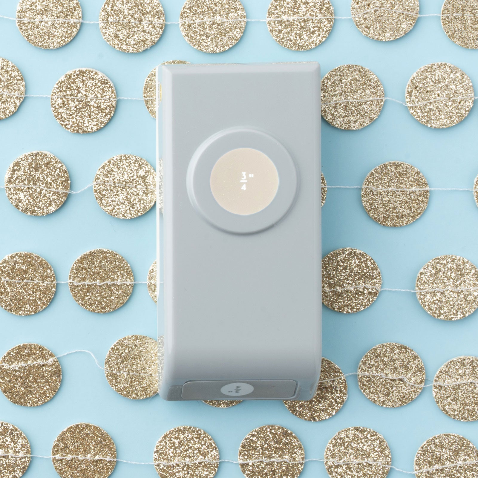 Lifestyle image of circle cut outs with the EK Tools 3/4 Inch Circle Paper Punch