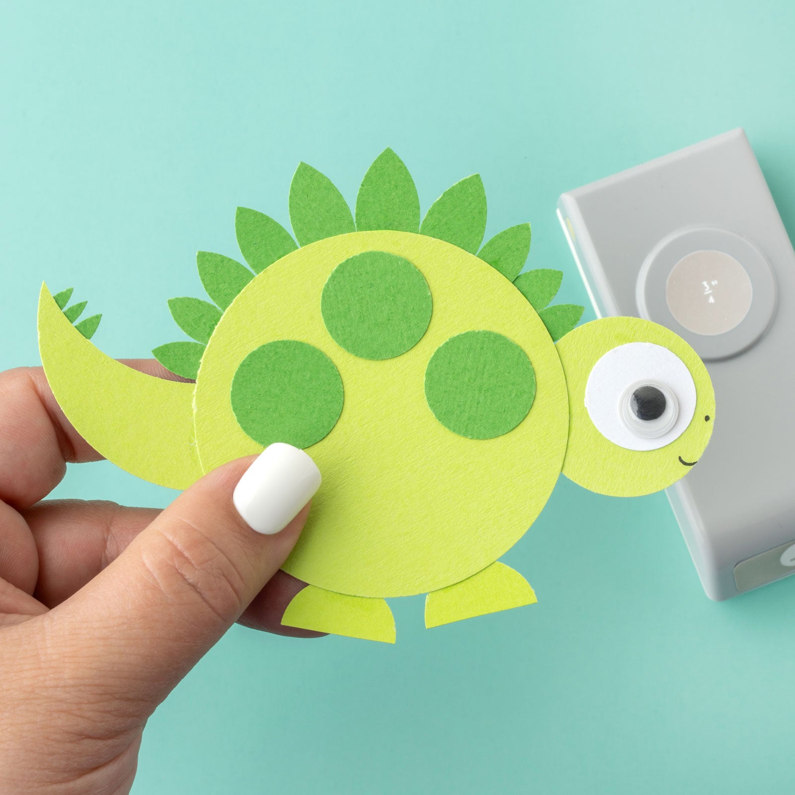 Lifestyle image of EK Tools 3/4 Inch Circle Paper Punch with dinosaur paper craft