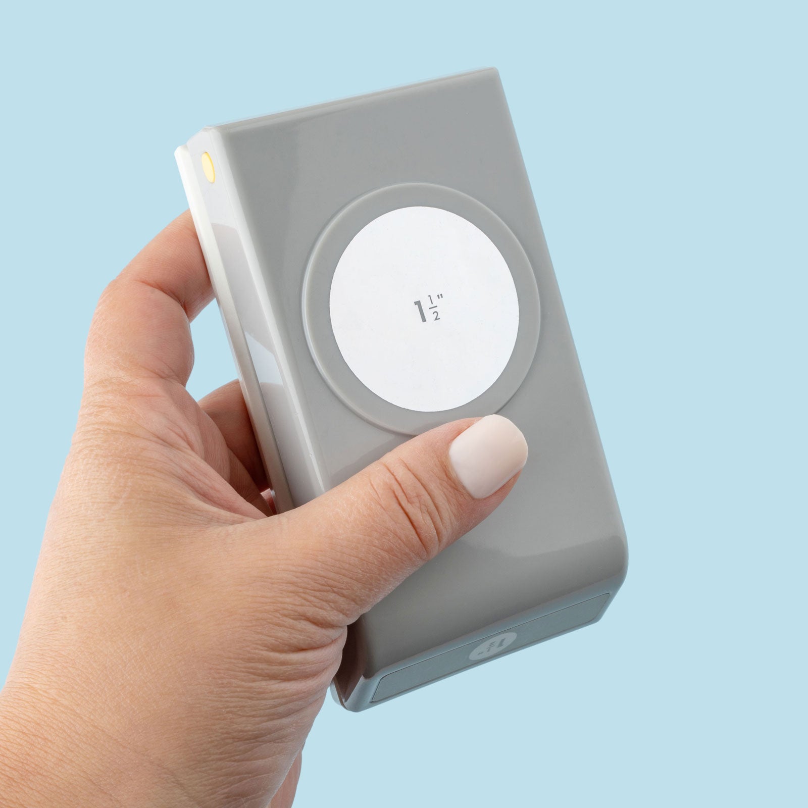 EK Tools 1 1/2 Inch Circle Paper Punch being held showing front of punch