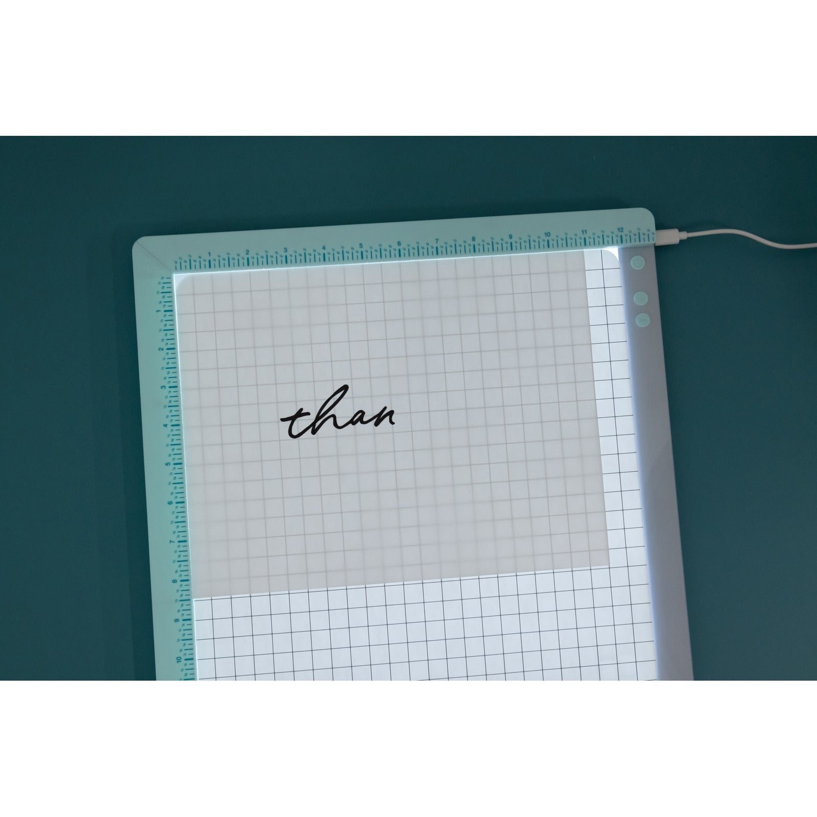 Lifestyle image of We R Makers Edge Align Light Pad being used to trace