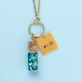 Load image into Gallery viewer, Lifestyle image of neckless with charm that has been stamped
