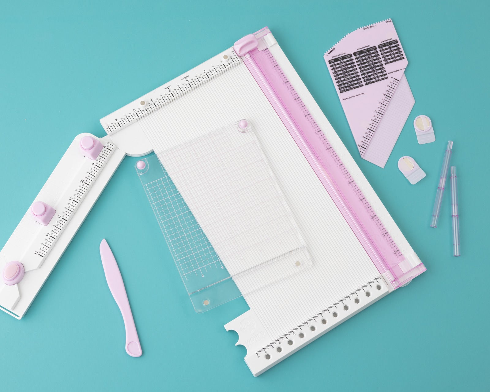 Lifestyle images of We R Makers All In One Scrapbooking Tool - lilac with all tools included