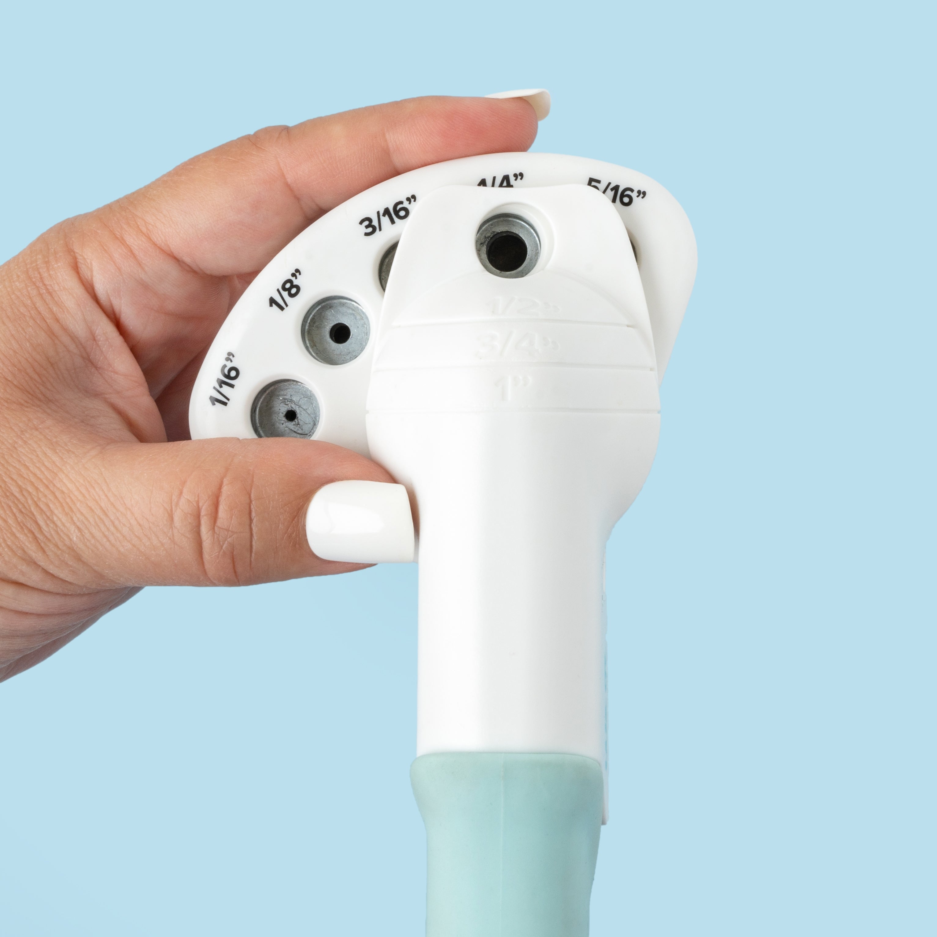 Close up of We R Makers Crop-A-Dile Circle Multi Hole Punch being held to show size