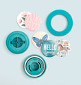 Load image into Gallery viewer, We R Makers Large Circle Button Press Insert with an assortment of finished buttons
