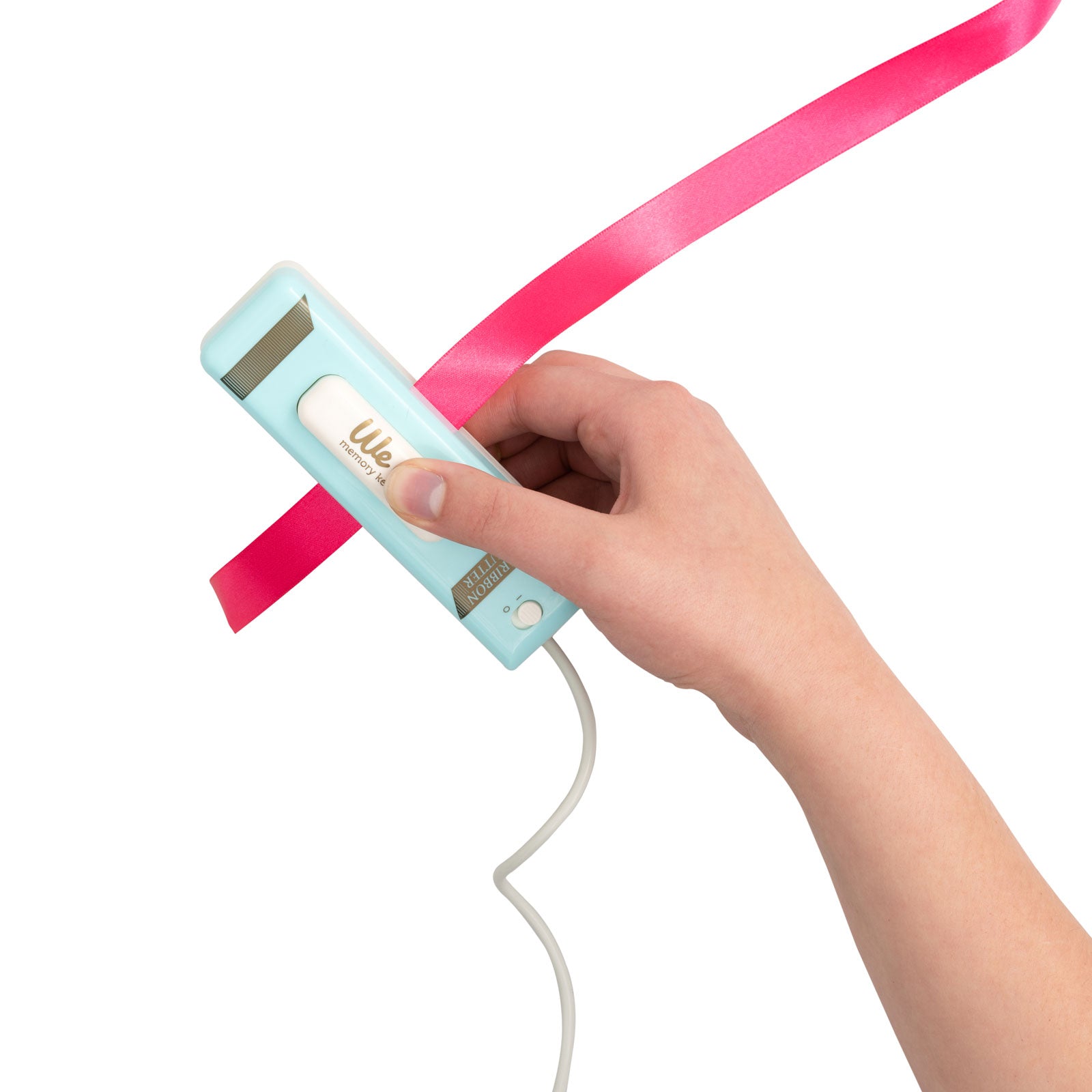 We R Makers USB Ribbon Cutter being used with pink ribbon