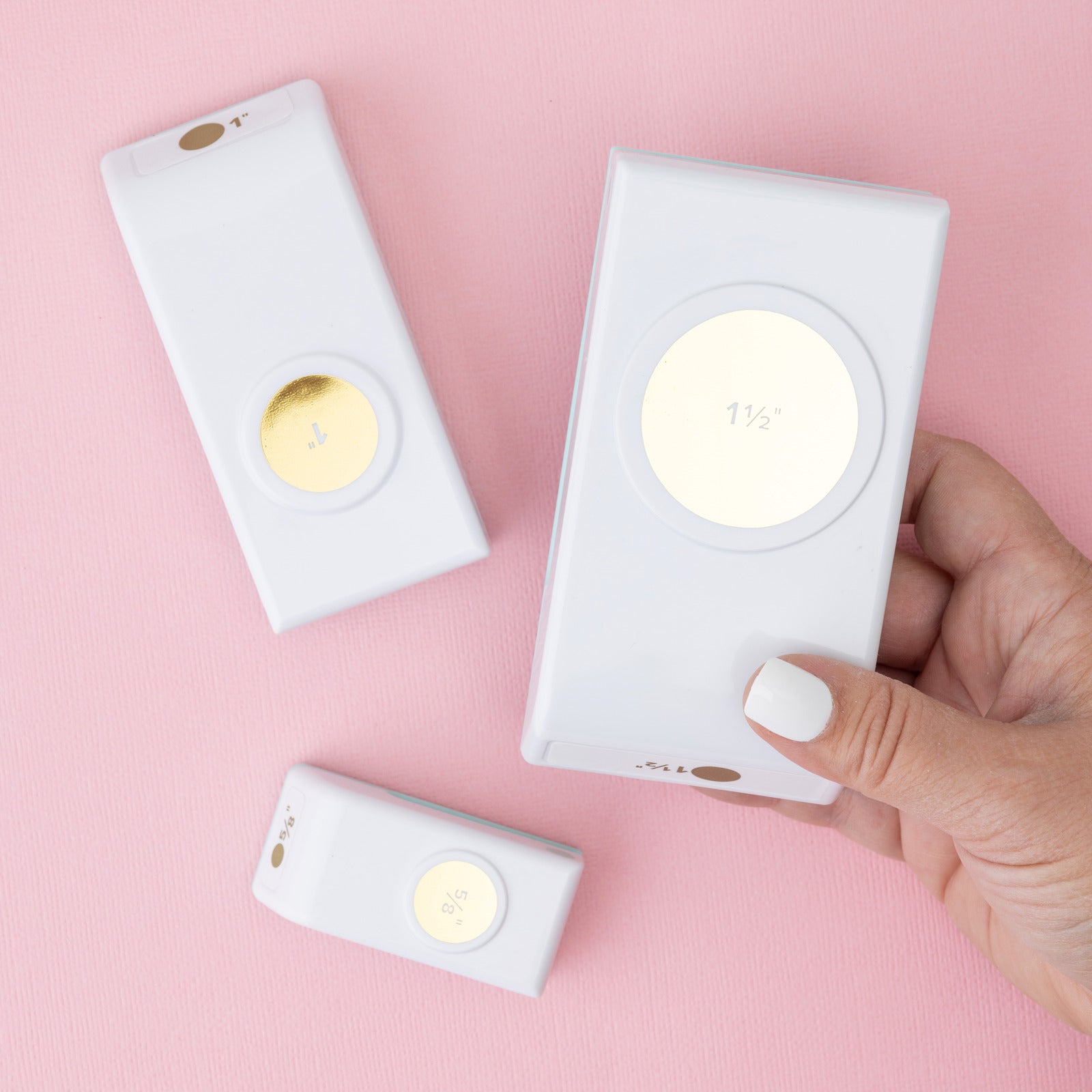 We R Makers Circle Layering 3 Pack Paper Punches with the 1.5 inch punch being held to show size