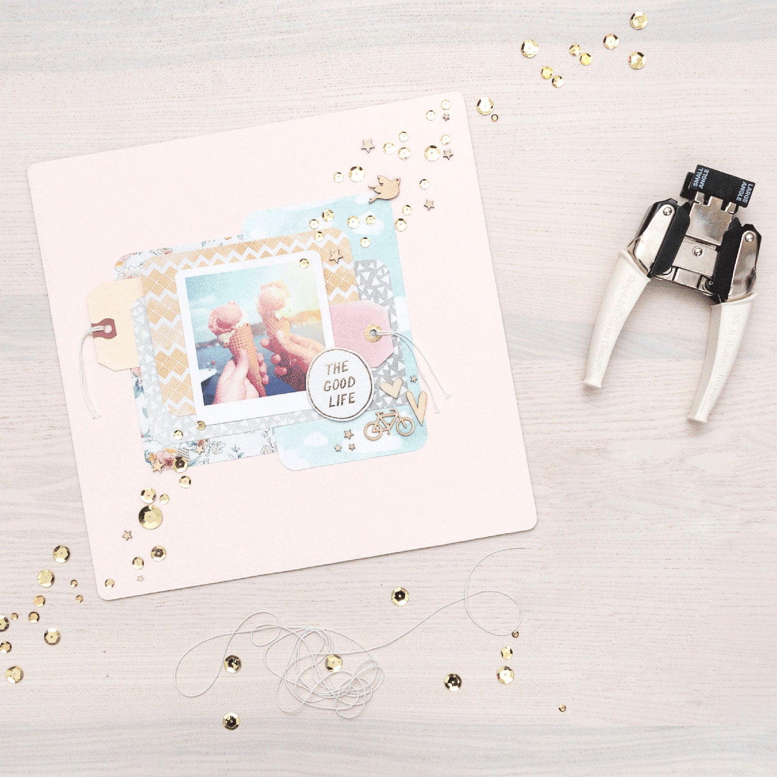 Lifestyle image of craft that used the We R Makers Crop-A-Dile Small & Large Angle Corner Chomper Punch