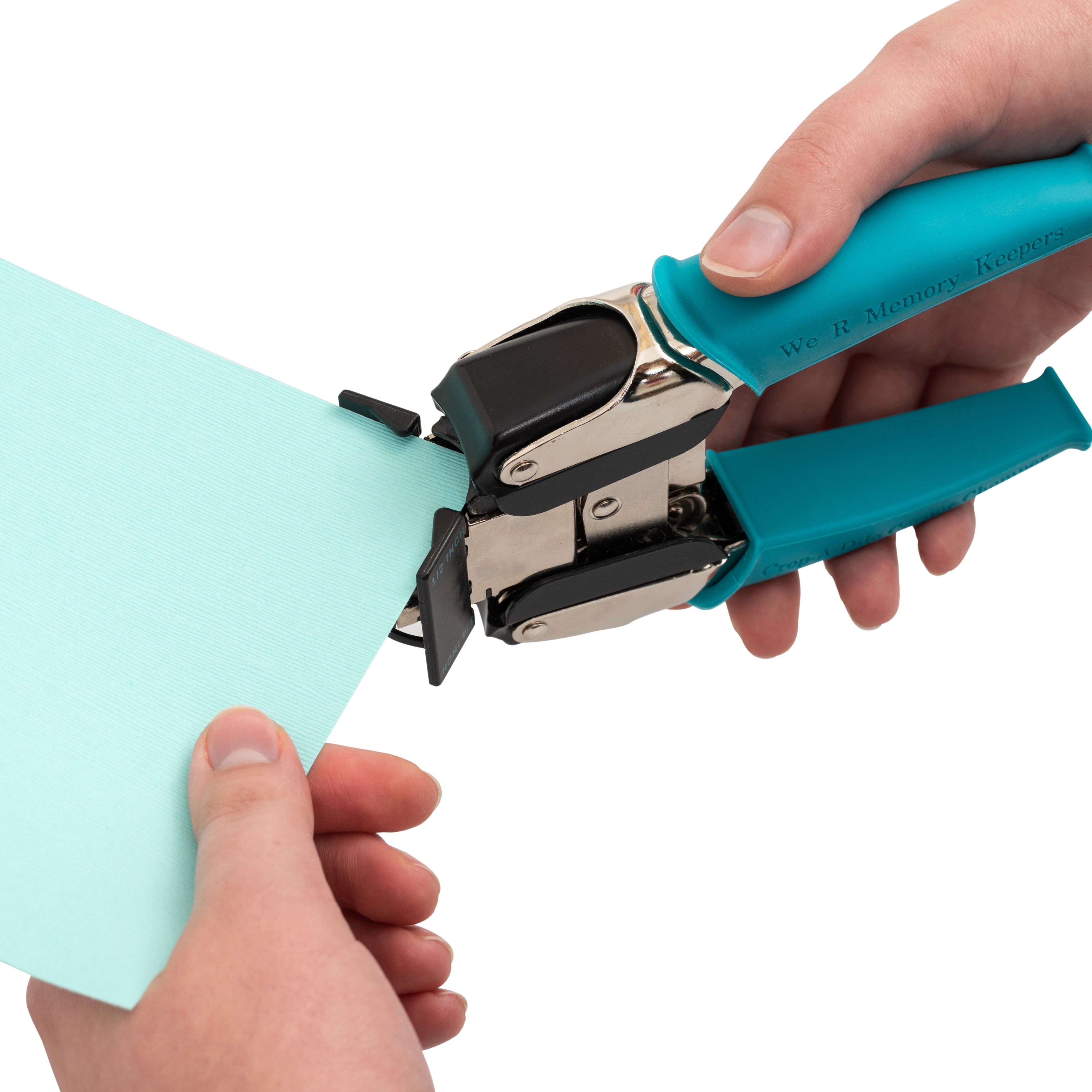 We R Makers Crop-A-Dile 1/4" & 1/2" Corner Chomper Punch being used on a piece of craft paper