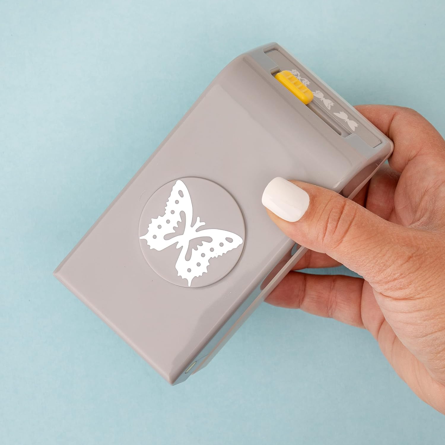 EK Tools Butterfly Laying Paper Punch being held