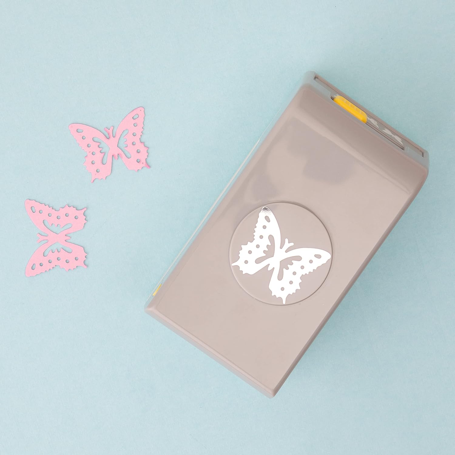 EK Tools Butterfly Laying Paper Punch with a few punched paper of butterfly shape