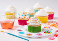 Load image into Gallery viewer, Image of cupcakes decorated with the Sweet Sugarbelle 8 oz Bottle Couplers.
