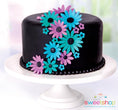 Load image into Gallery viewer, Picture of a black cake with neon flowerws on it.
