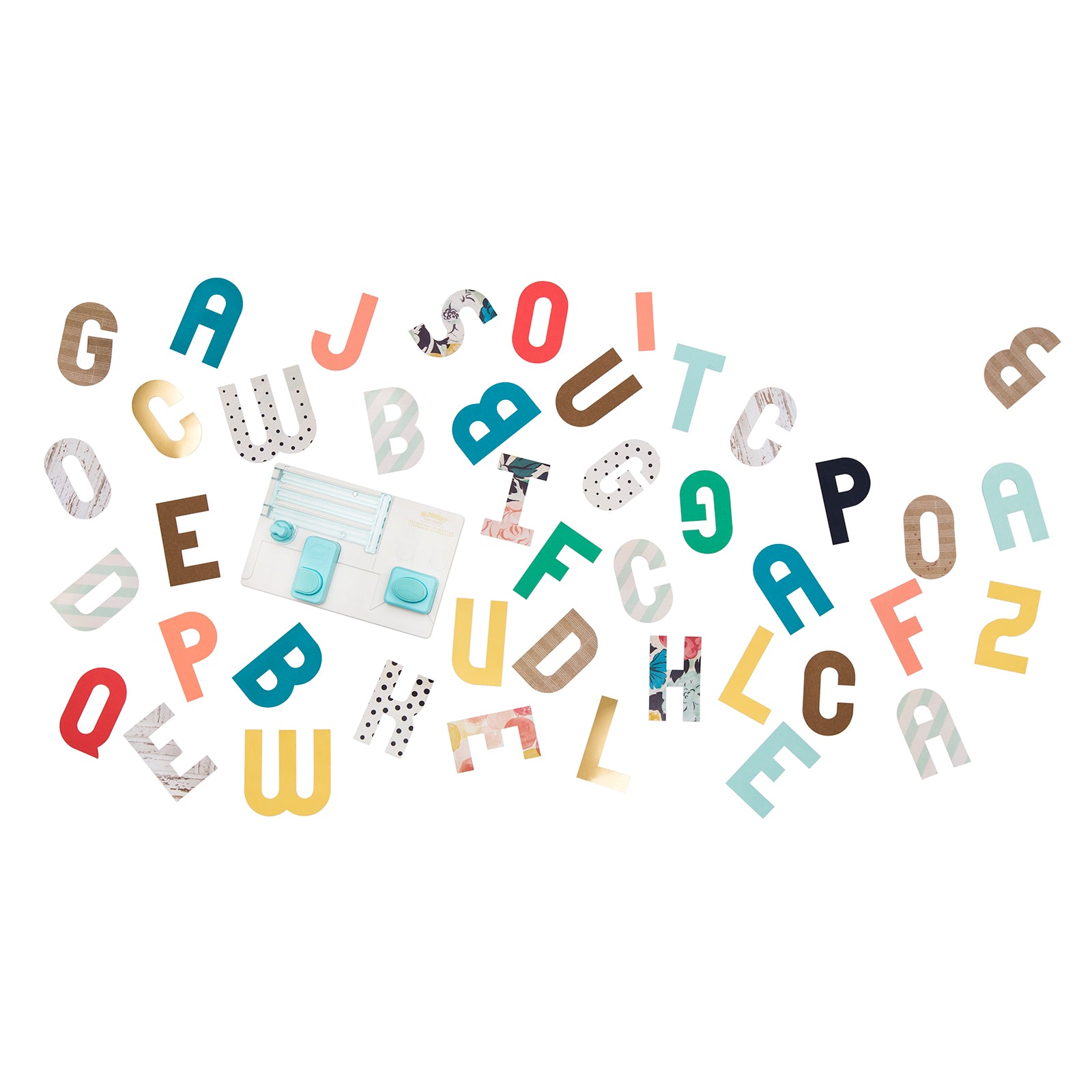 Pictures of letters punched out by the We R Makers Alphabet Punch Board.