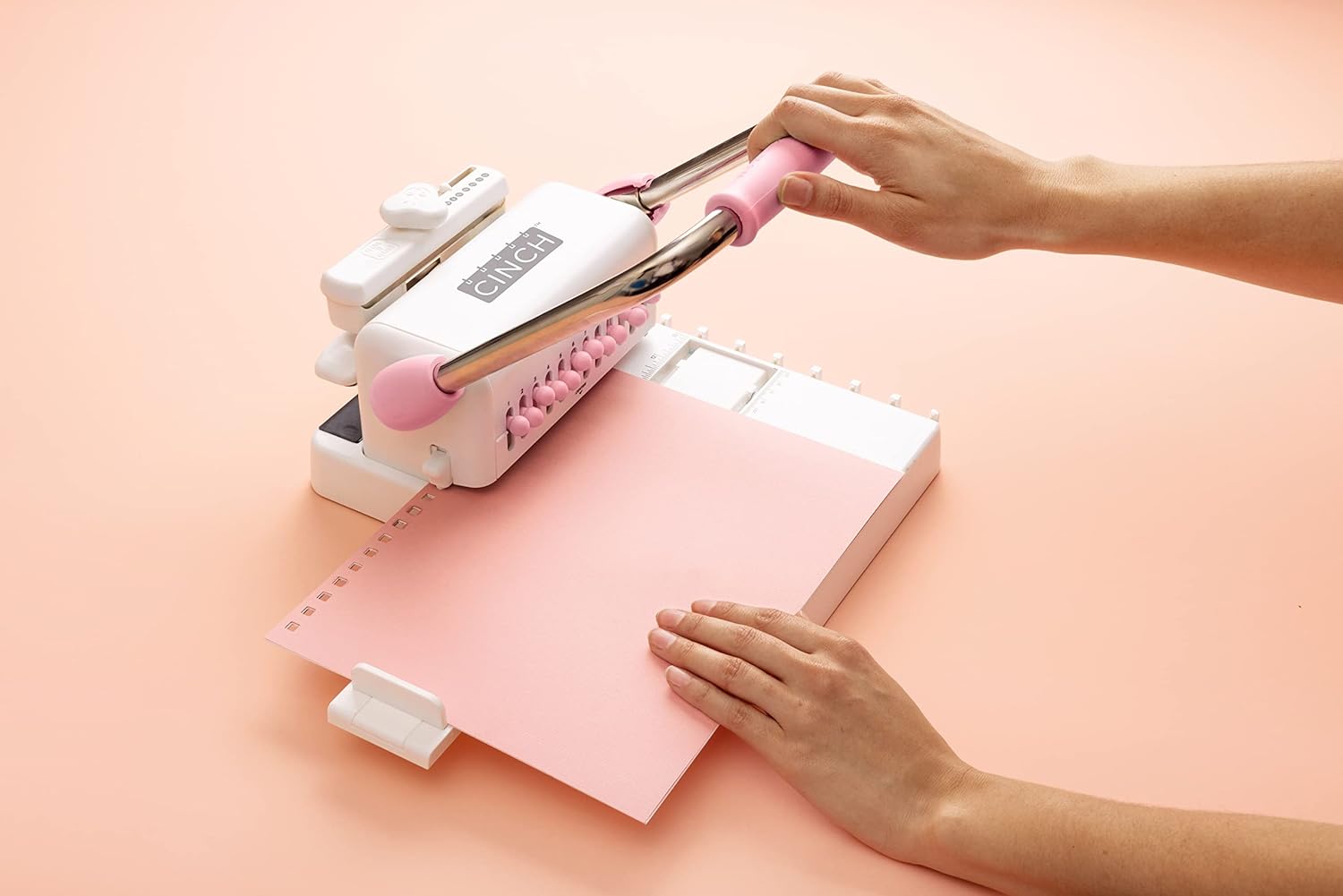 Lifestyle image of We R Makers Cinch Book Binding Machine 2 being used 