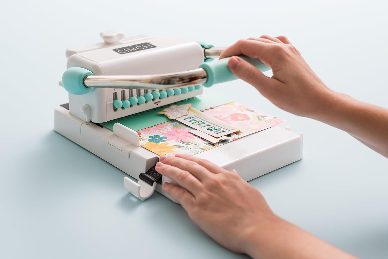 Close up mint Cinch book binding machine in use