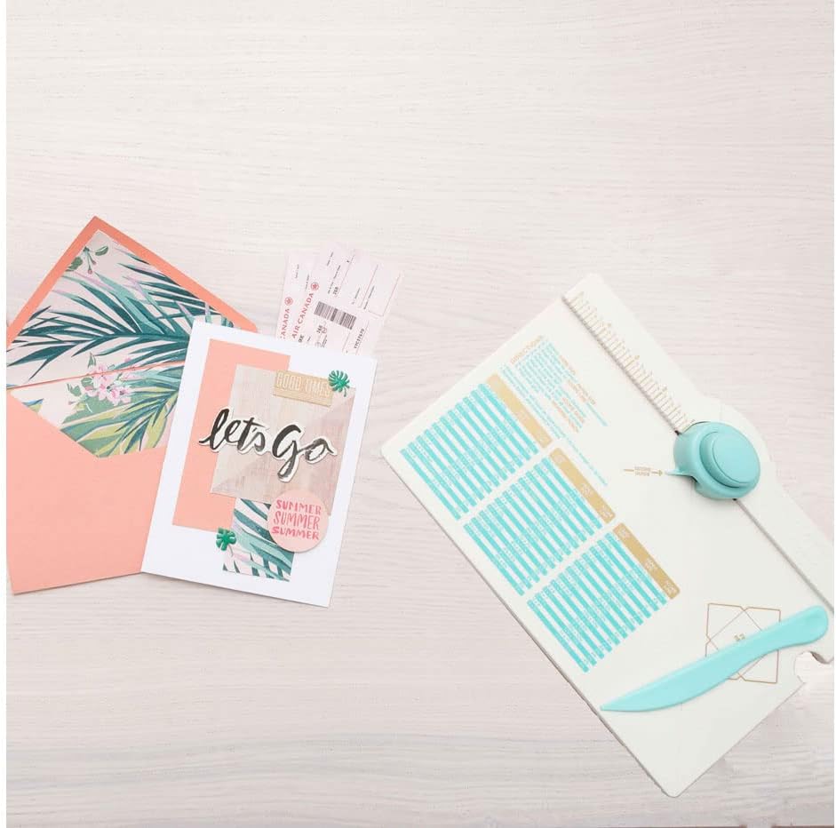 Lifestyle image of the We R Makers Envelope Punch Board next to an art project.