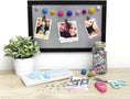 Load image into Gallery viewer, Lifestyle image of decorations created by using the We R Makers Frame Punch Board.
